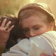 Rey and Leia hug.